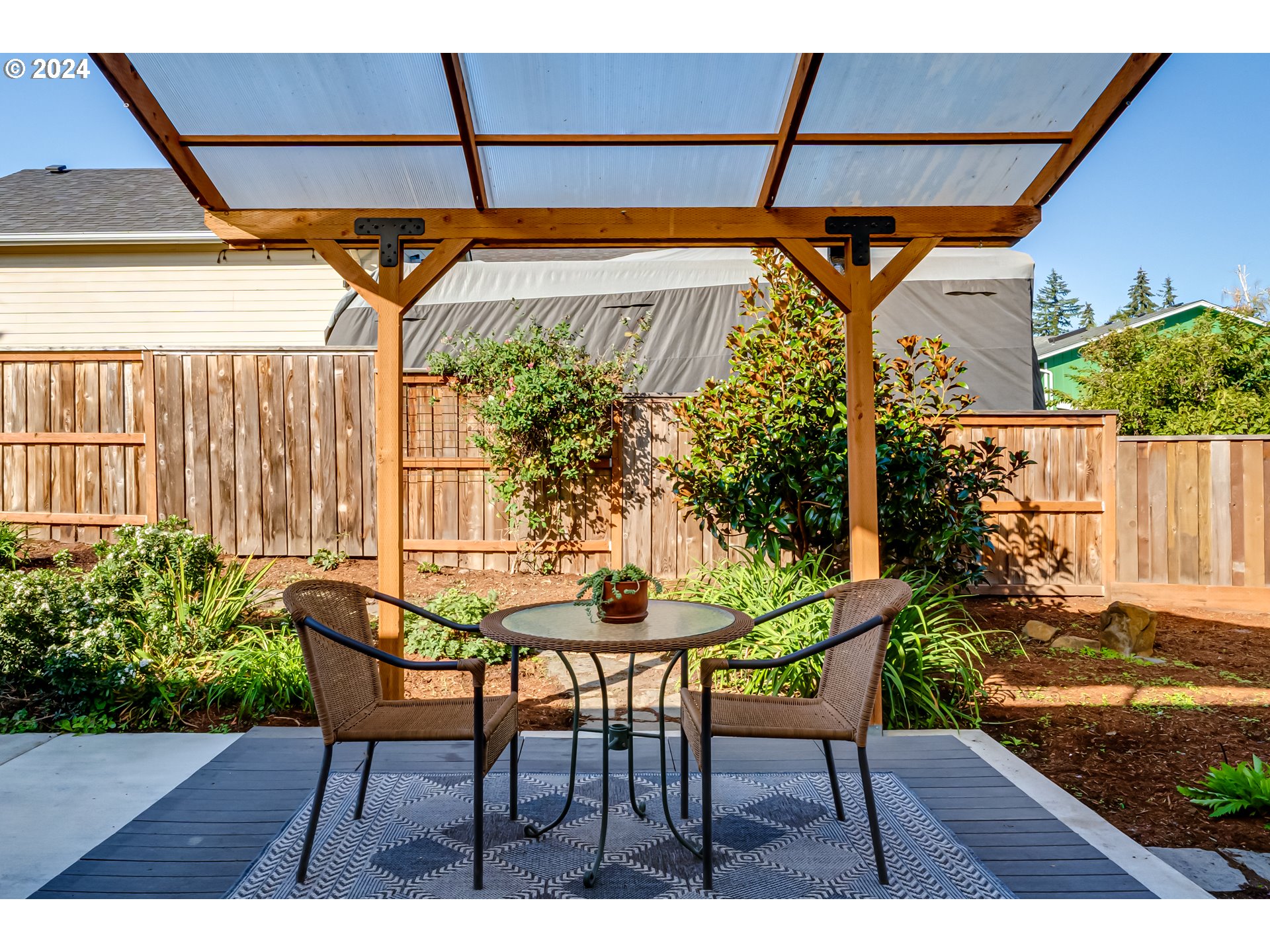 686 South 69th Place Springfield, OR 97478 - Photo 30 of 38 a backyard of a house with table and chairs