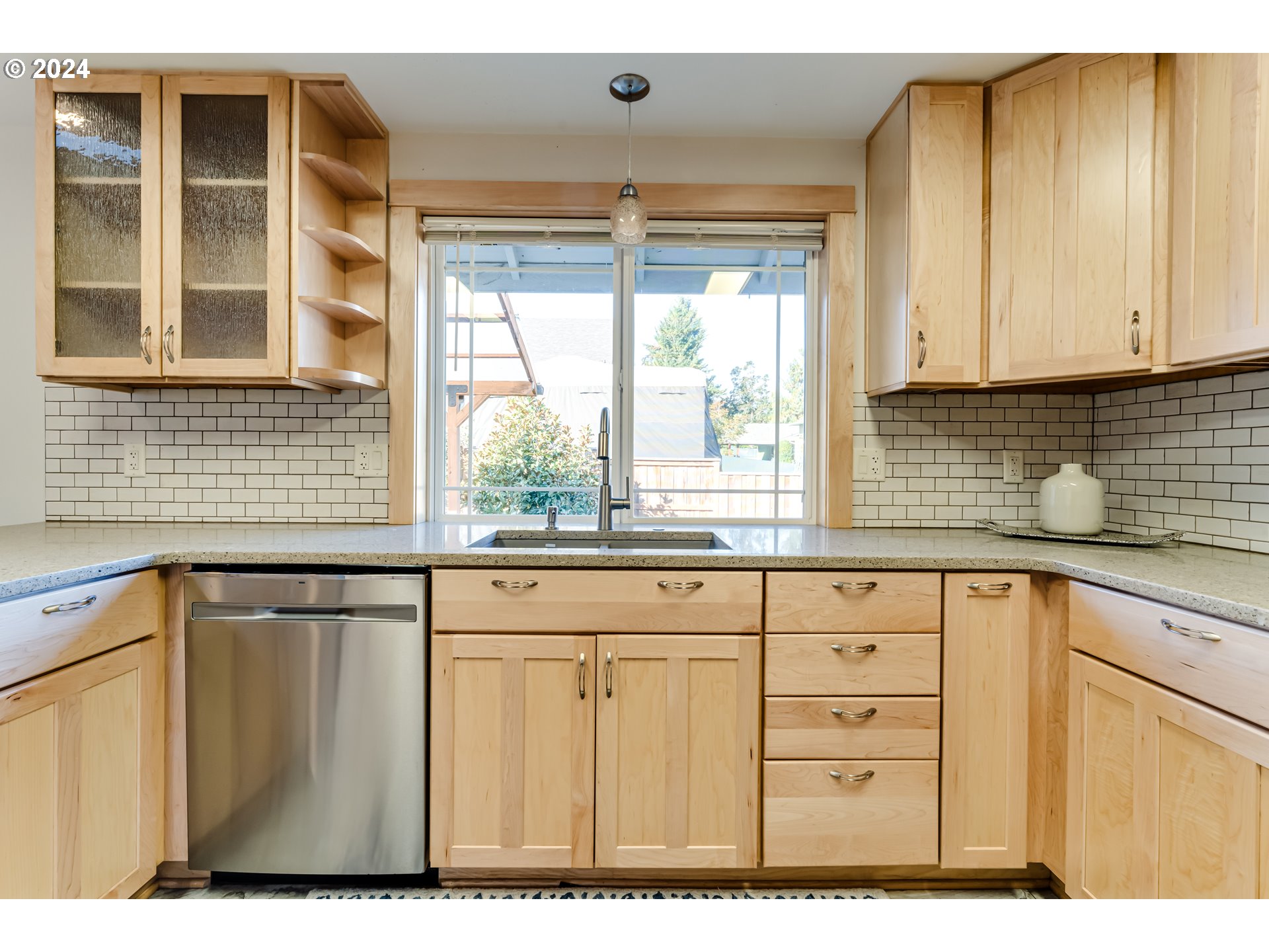 686 South 69th Place Springfield, OR 97478 - Photo 10 of 38 a kitchen with a window wooden floor and cabinets