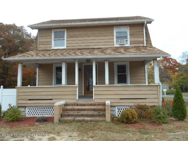 300 Drum Point Road Brick, NJ 08723 - Photo 1 of 1 a brick house with a small yard and large window