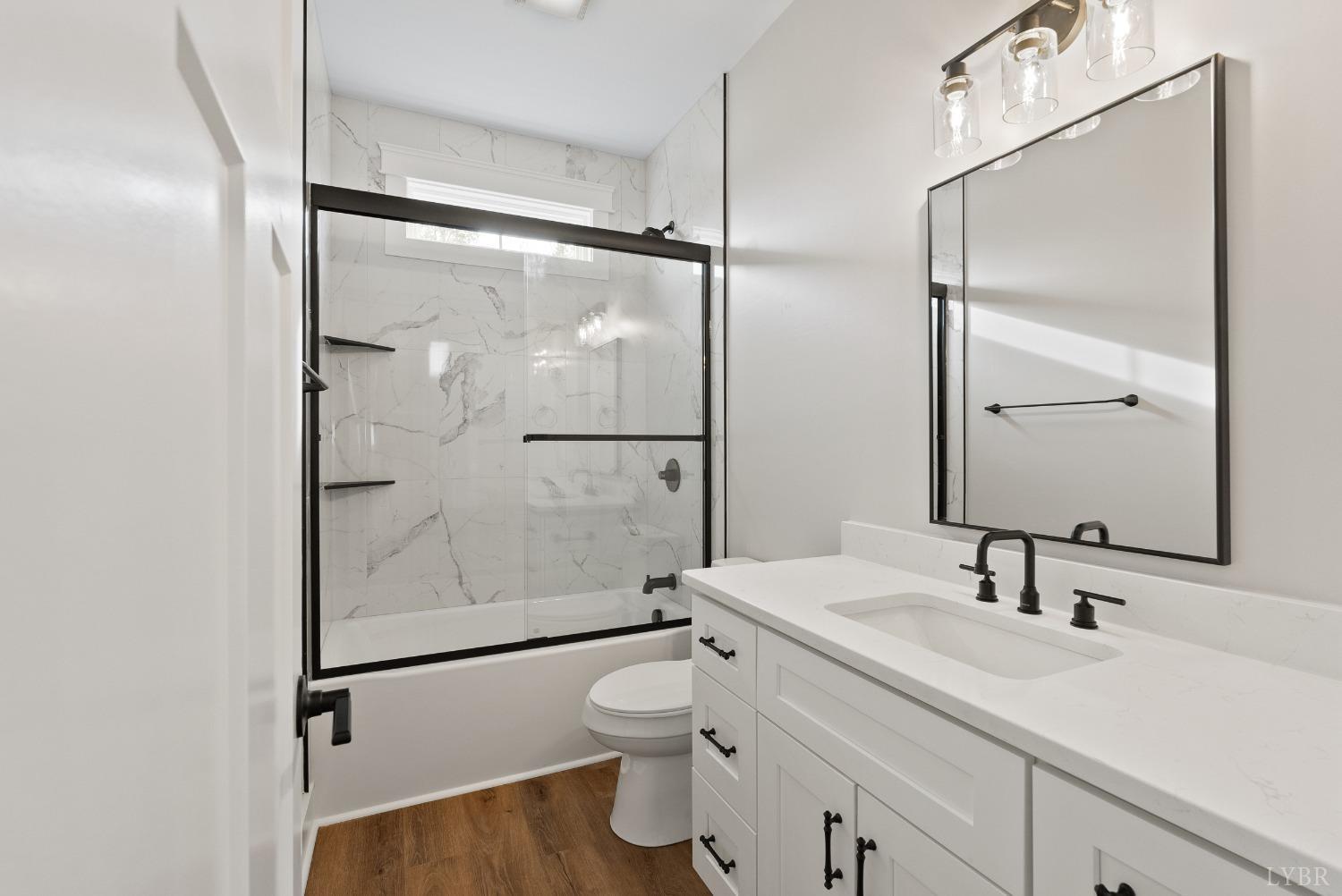 62 Burrell Drive Rustburg, VA 24588 - Photo 11 of 63 a bathroom with a sink toilet and shower