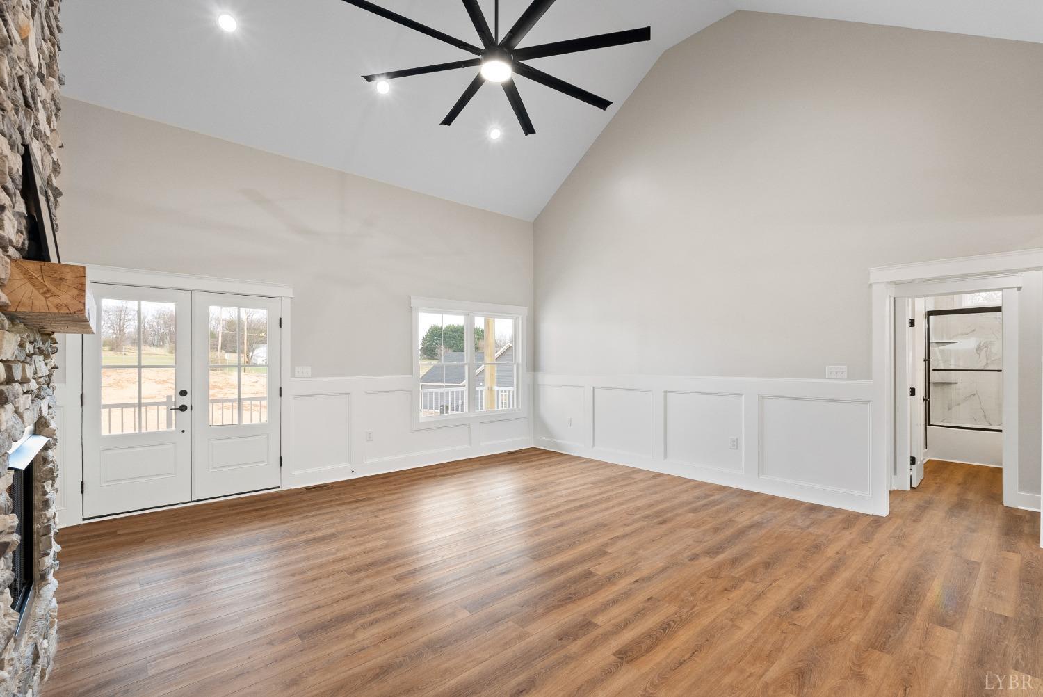 62 Burrell Drive Rustburg, VA 24588 - Photo 19 of 63 an empty room with wooden floor and windows
