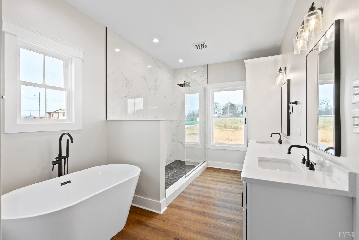 62 Burrell Drive Rustburg, VA 24588 - Photo 29 of 63 a bathroom with a tub sink and mirror