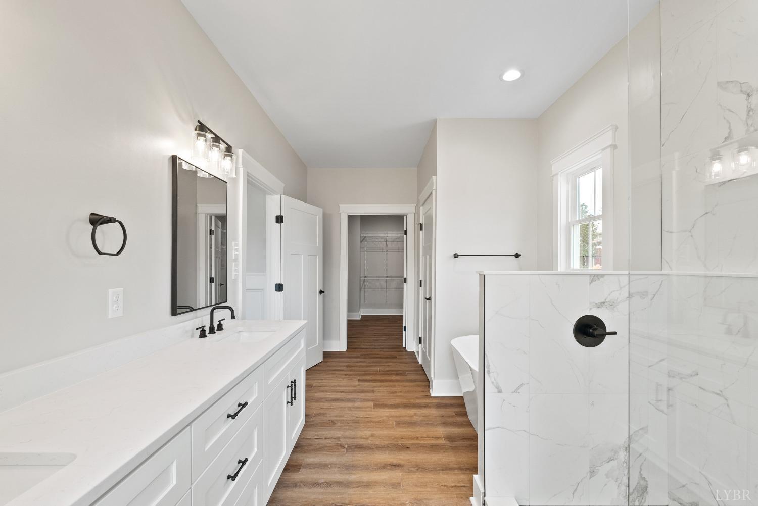 62 Burrell Drive Rustburg, VA 24588 - Photo 32 of 63 a spacious bathroom with double vanity and mirrors