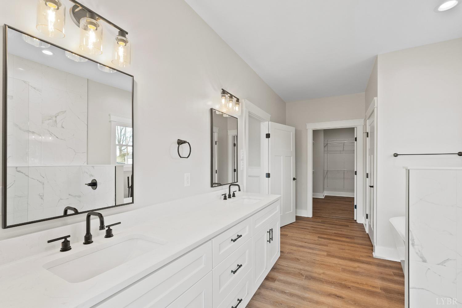 62 Burrell Drive Rustburg, VA 24588 - Photo 33 of 63 a bathroom with double vanity sinks and a mirror