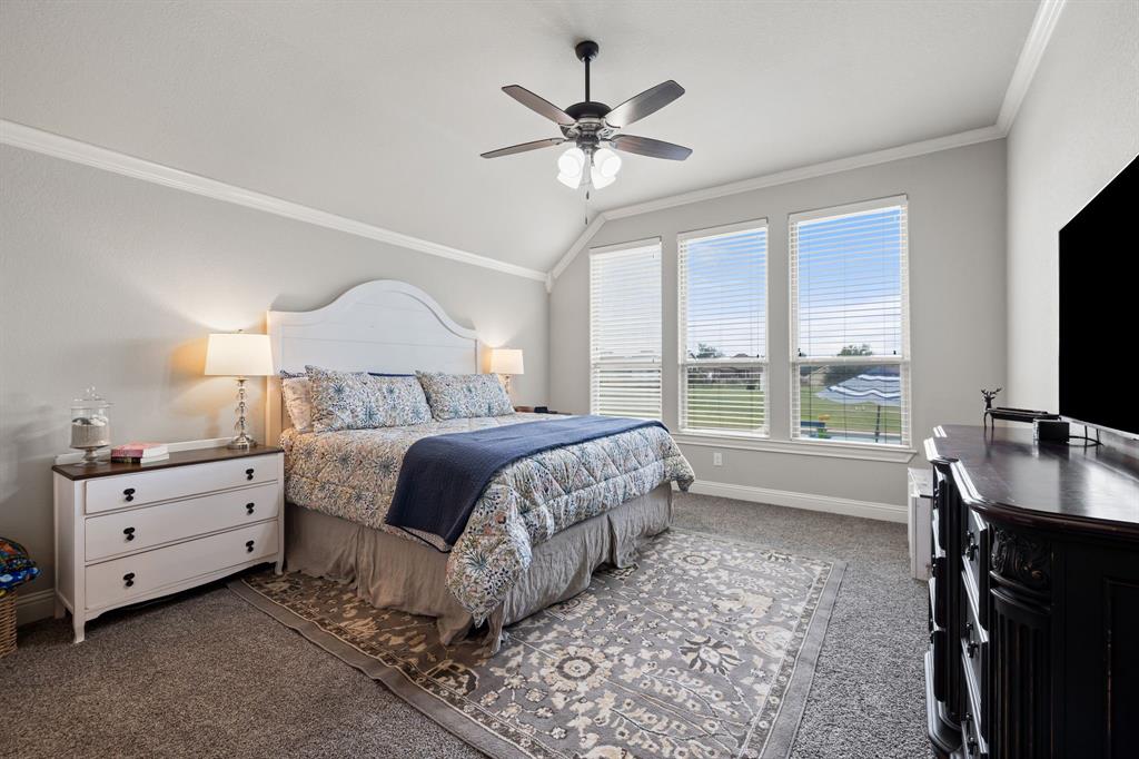 2103 Cash Point Court Granbury, TX 76049 - Photo 15 of 38 a bedroom with a bed and a flat screen tv