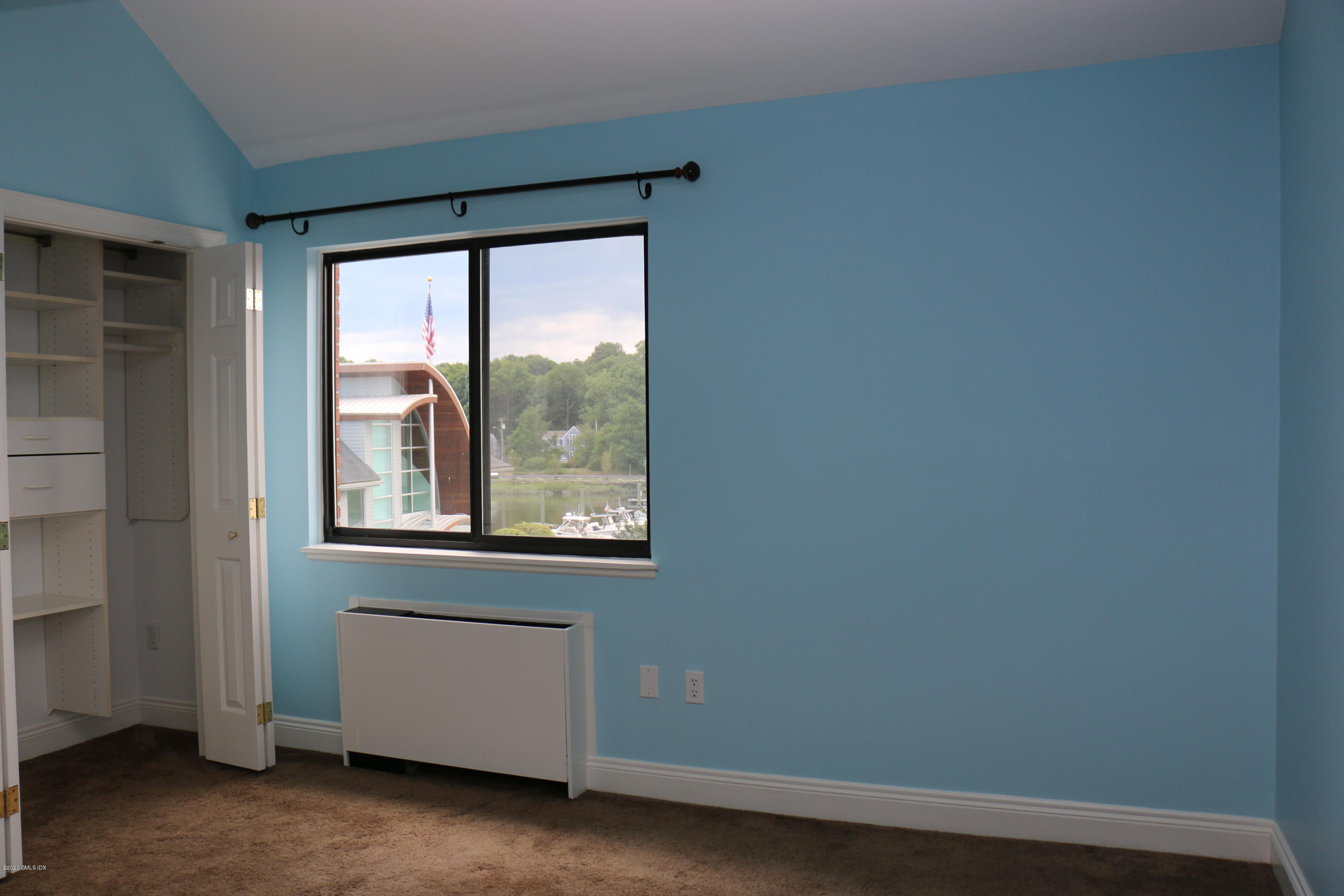 11 River Road, Unit 114 Cos Cob, CT 06807 - Photo 11 of 21 a view of a room that has a window in it