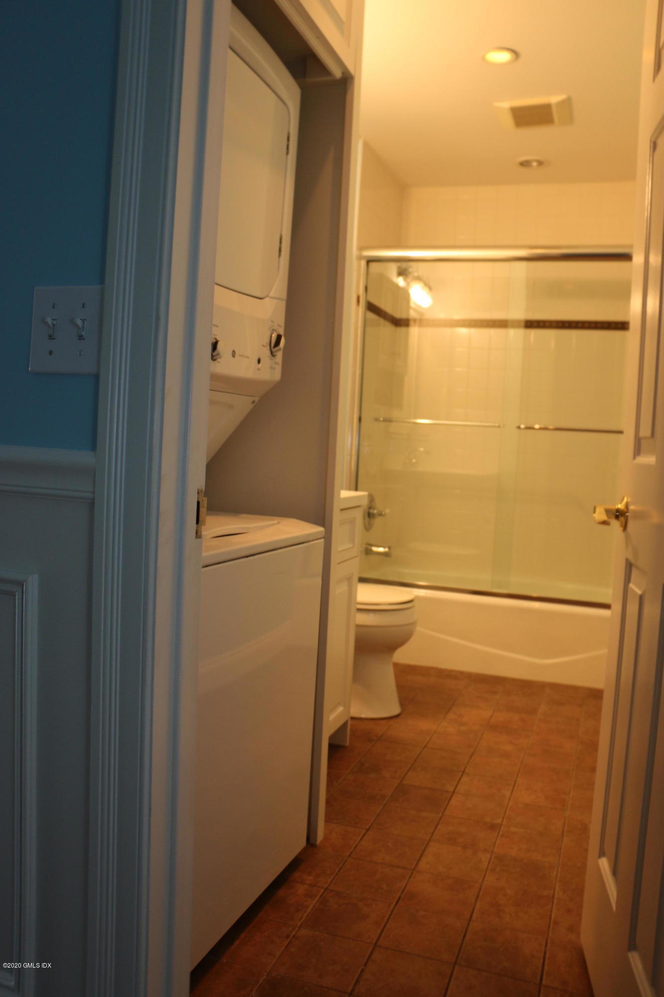 11 River Road, Unit 114 Cos Cob, CT 06807 - Photo 16 of 21 a bathroom with a granite countertop toilet and a shower