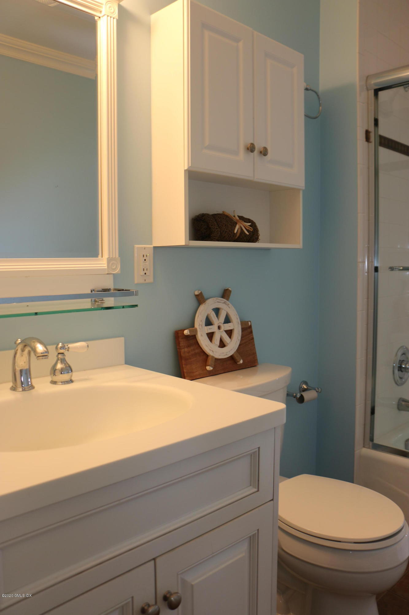 11 River Road, Unit 114 Cos Cob, CT 06807 - Photo 17 of 21 a bathroom with a sink a toilet and vanity