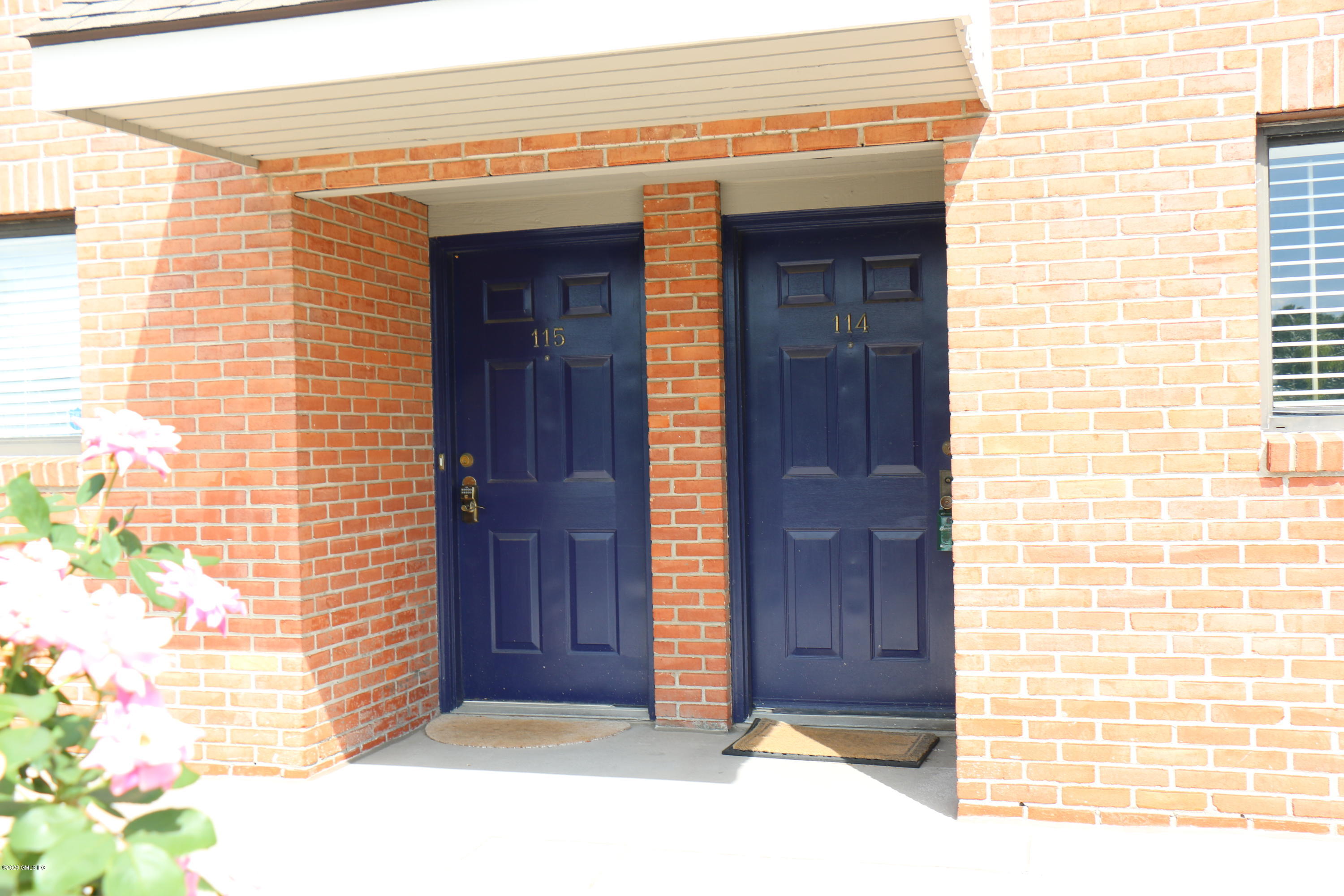 11 River Road, Unit 114 Cos Cob, CT 06807 - Photo 2 of 21 a view of entrance door of the house