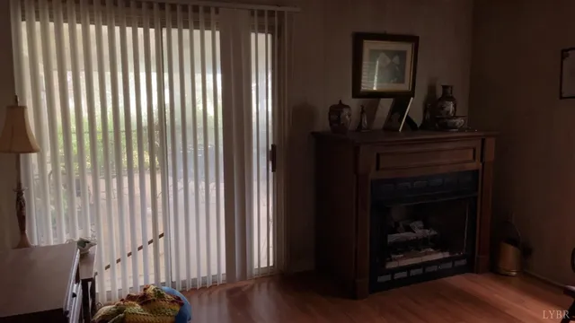 a view of a livingroom with furniture and hardwood floor