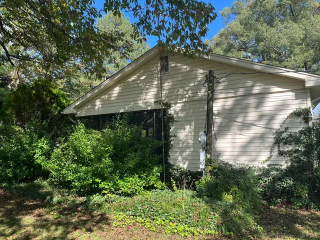 a backyard of a house with lots of green space