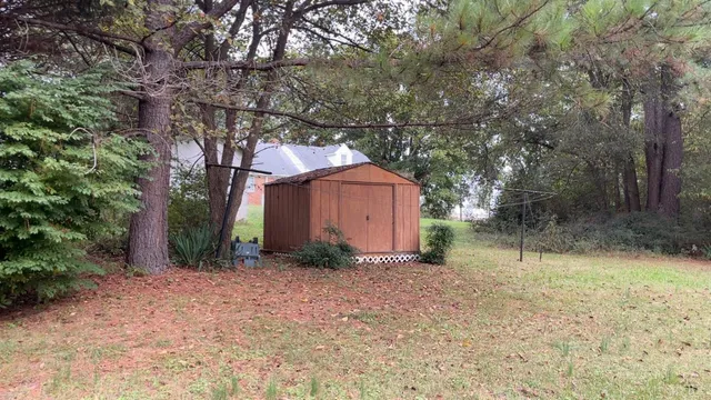 a backyard of a house with lots of green space