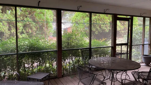 a view of a room with furniture and window