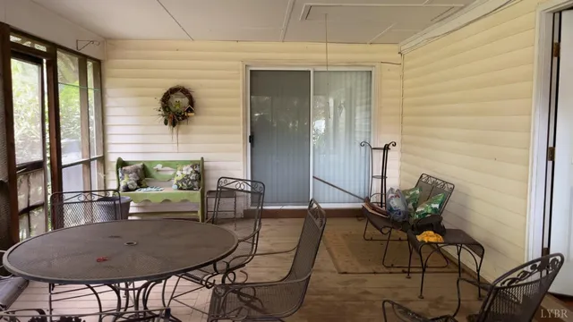 a view of a dining room with furniture and a window