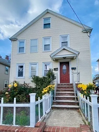a front view of a house with stairs and stairs
