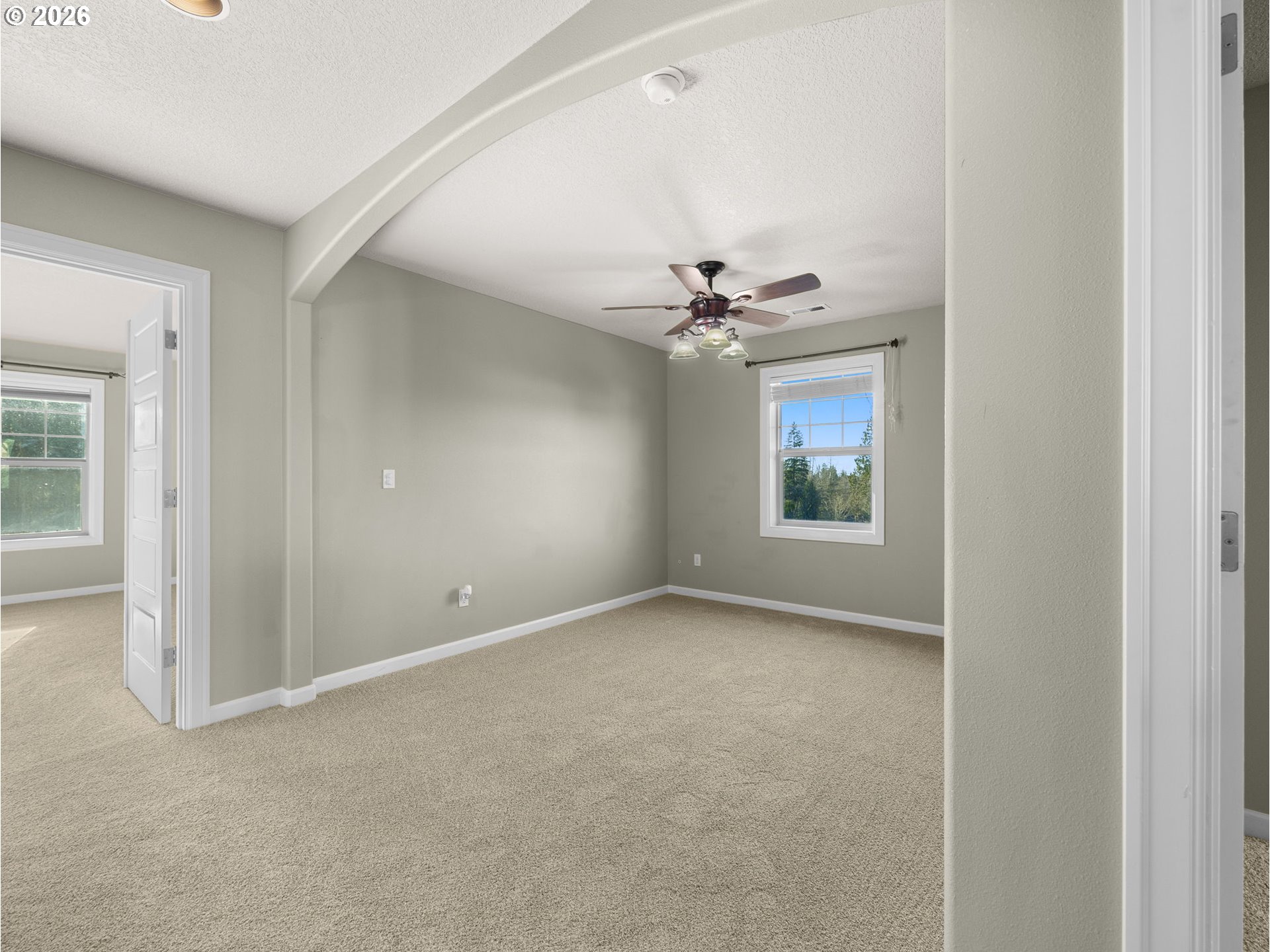 40192 Laurel Street Sandy, OR 97055 - Photo 18 of 37 a view of an empty room with window and chandelier fan