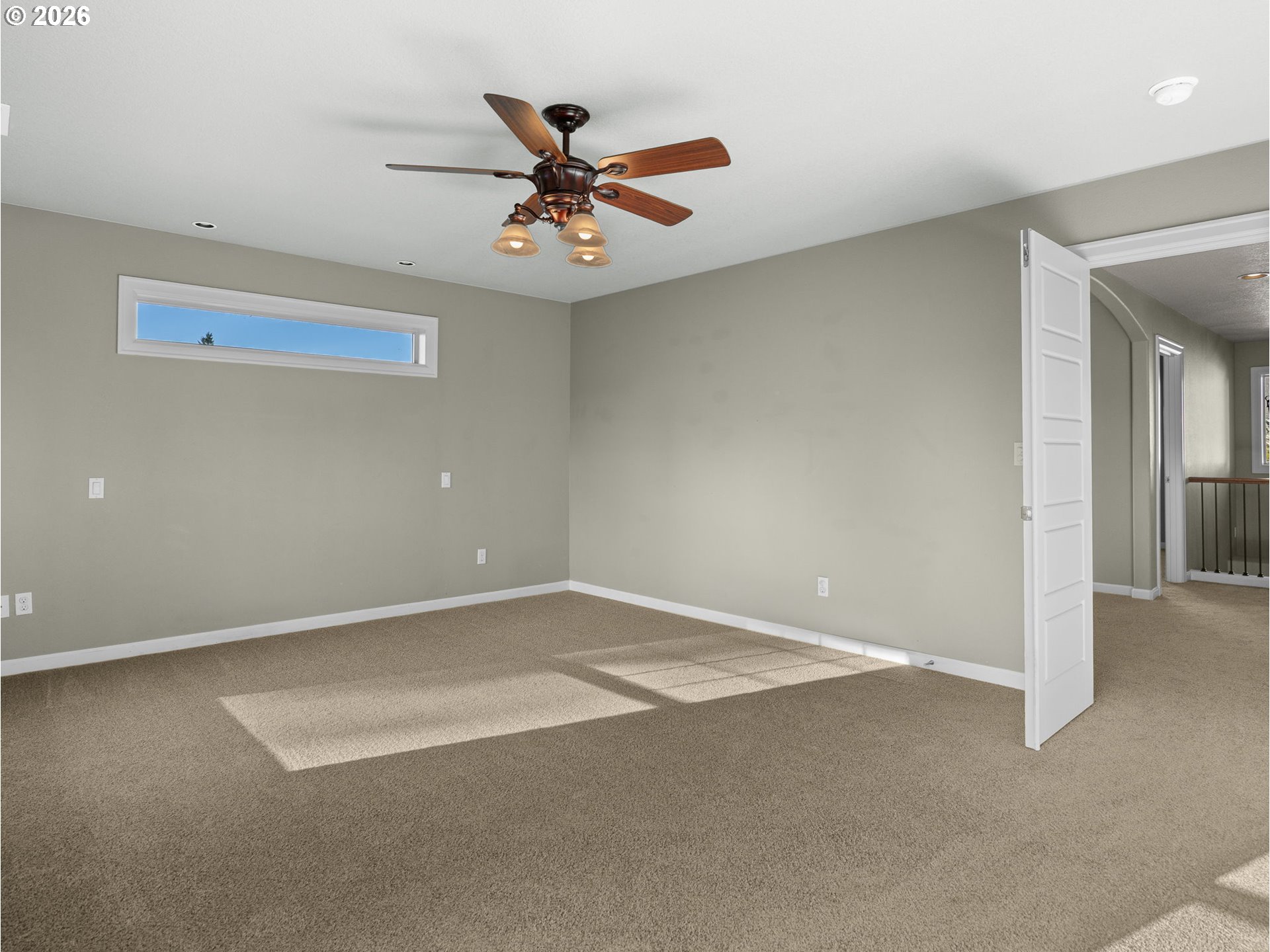40192 Laurel Street Sandy, OR 97055 - Photo 20 of 37 an empty room with a chandelier fan and windows