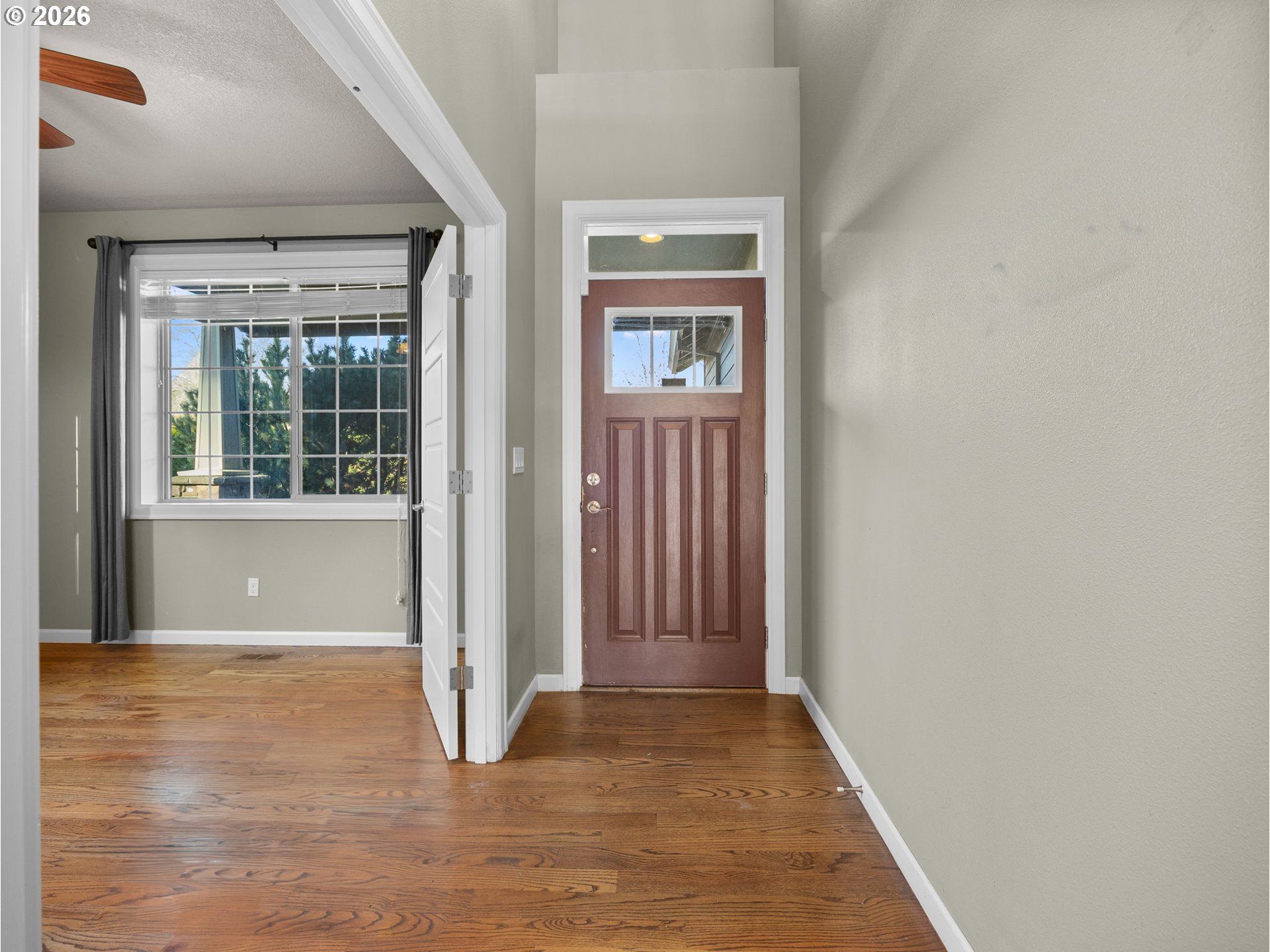 40192 Laurel Street Sandy, OR 97055 - Photo 2 of 37 an empty room with wooden floor and windows
