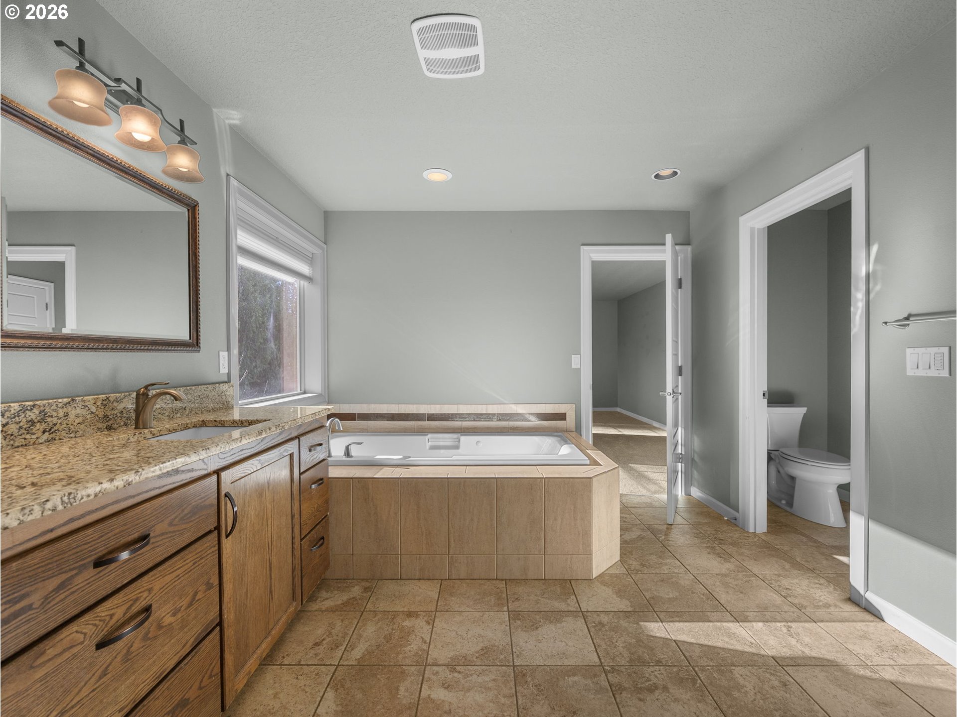 40192 Laurel Street Sandy, OR 97055 - Photo 24 of 37 a spacious bathroom with a tub sink and mirror