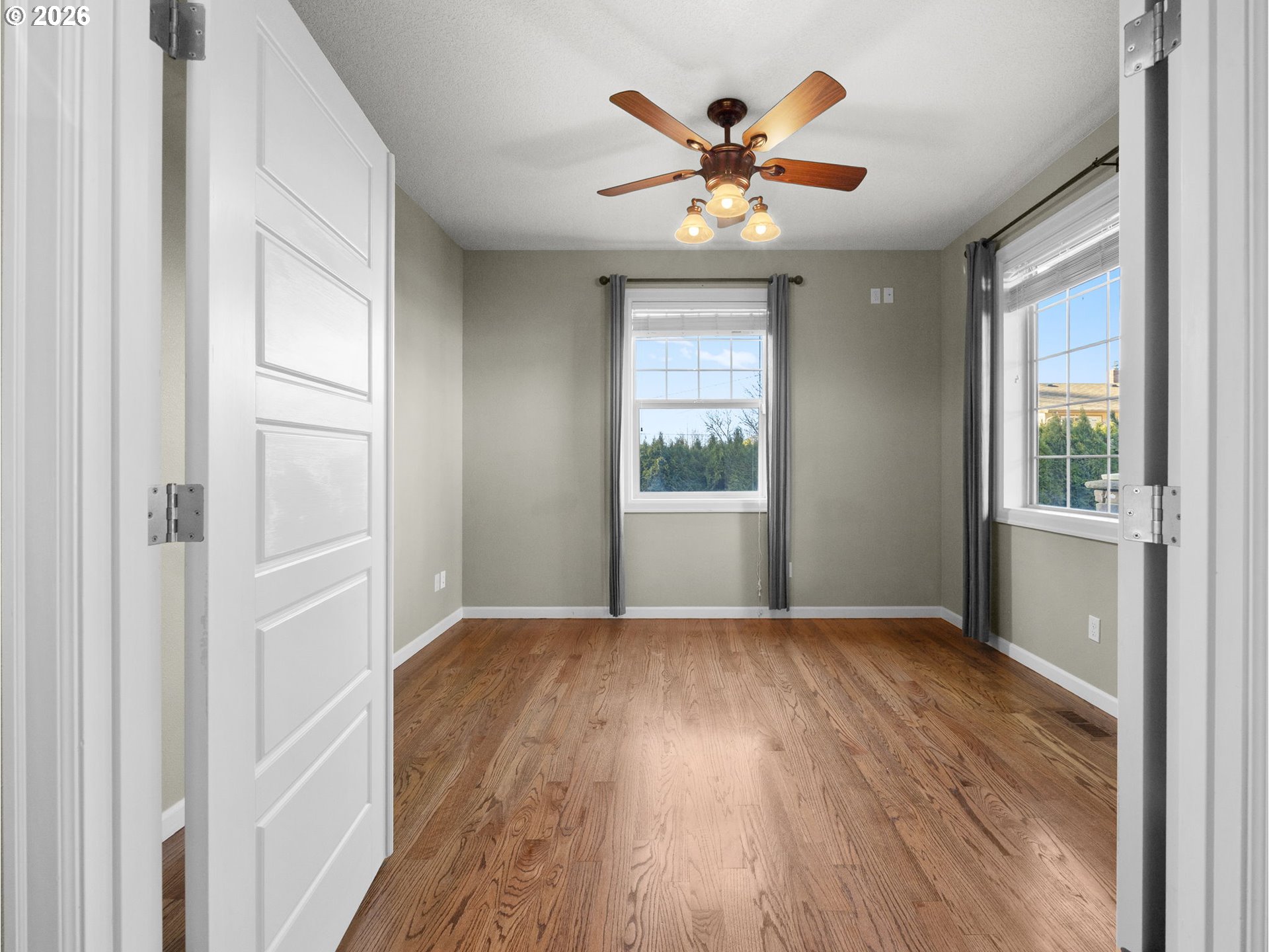 40192 Laurel Street Sandy, OR 97055 - Photo 3 of 37 a view of an empty room with a window and wooden floor