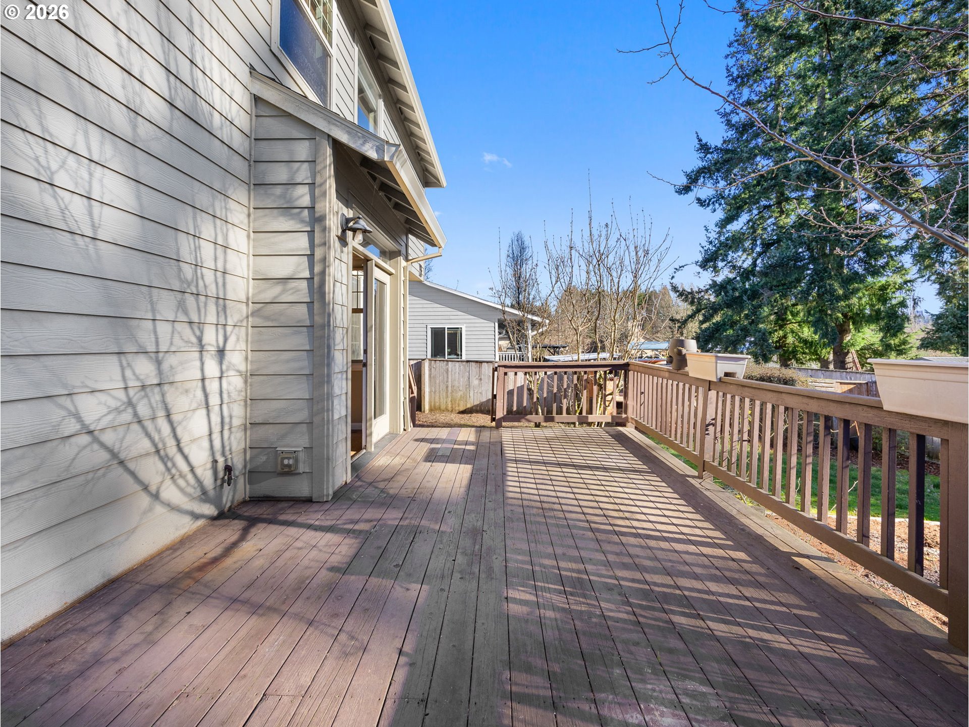 40192 Laurel Street Sandy, OR 97055 - Photo 33 of 37 a view of a balcony with wooden floor and fence and a pot