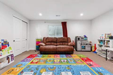 a living room with toys and a couch