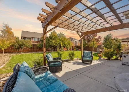 a view of a patio with couches and pool