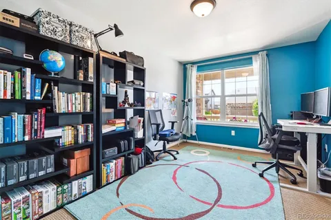 a room with lots of furniture and gym equipment