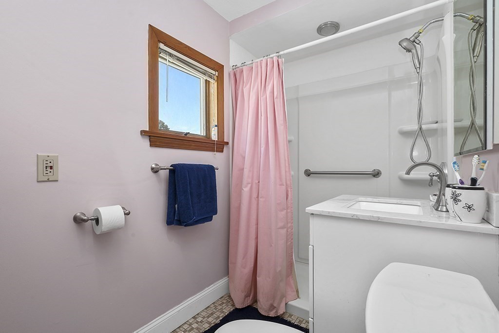 61 Everett Street Everett, MA 02149 - Photo 16 of 19 a bathroom with a sink vanity and mirror