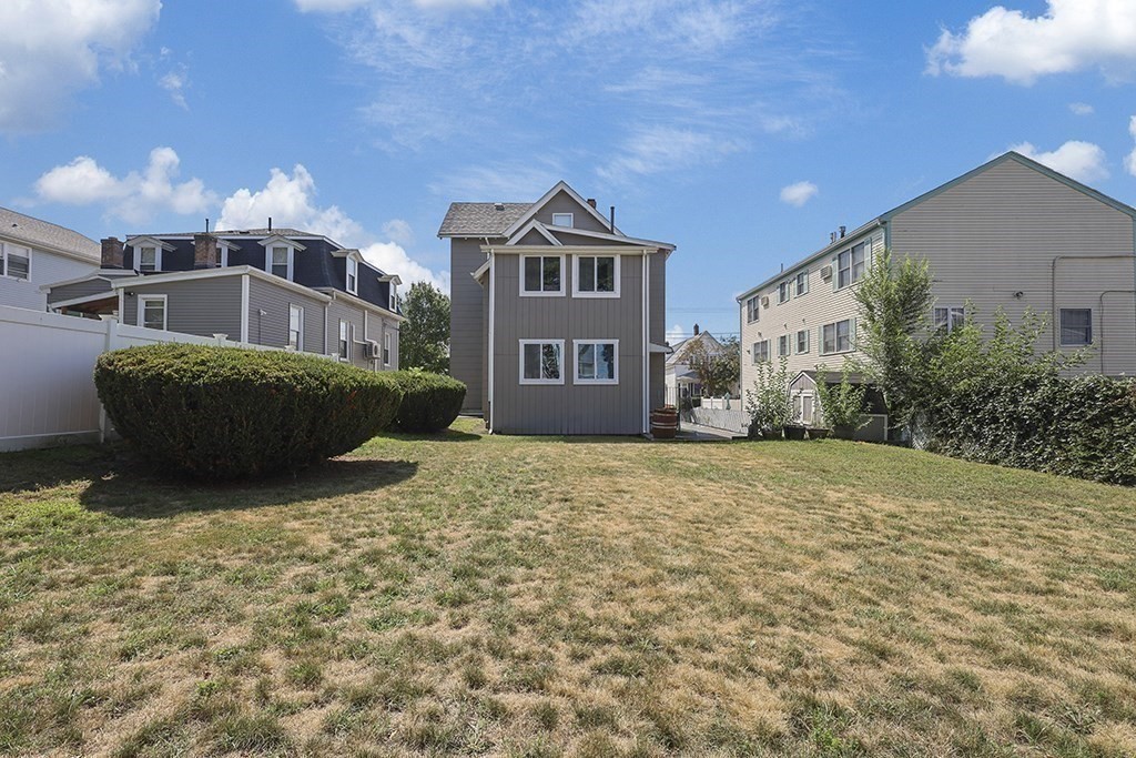 61 Everett Street Everett, MA 02149 - Photo 17 of 19 a front view of a house with a yard