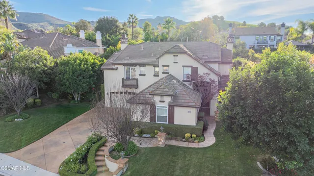 an aerial view of houses with yard