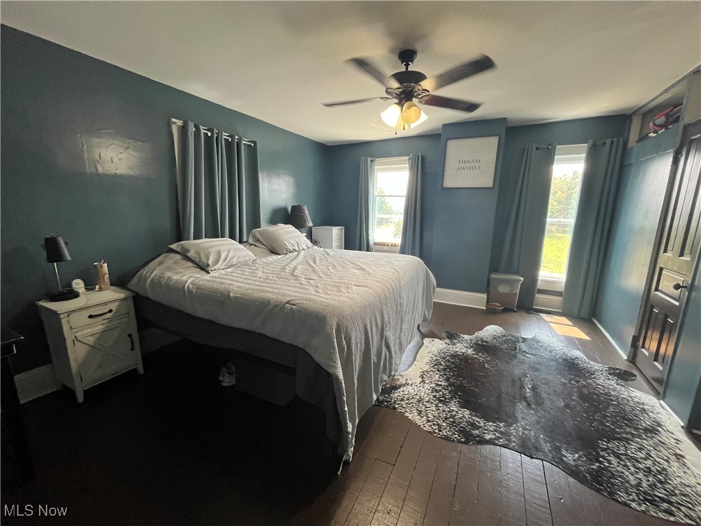 73475 Broadhead Road Kimbolton, OH 43749 - Photo 17 of 30 Bedroom with ceiling fan, hardwood / wood-style flooring, and multiple windows