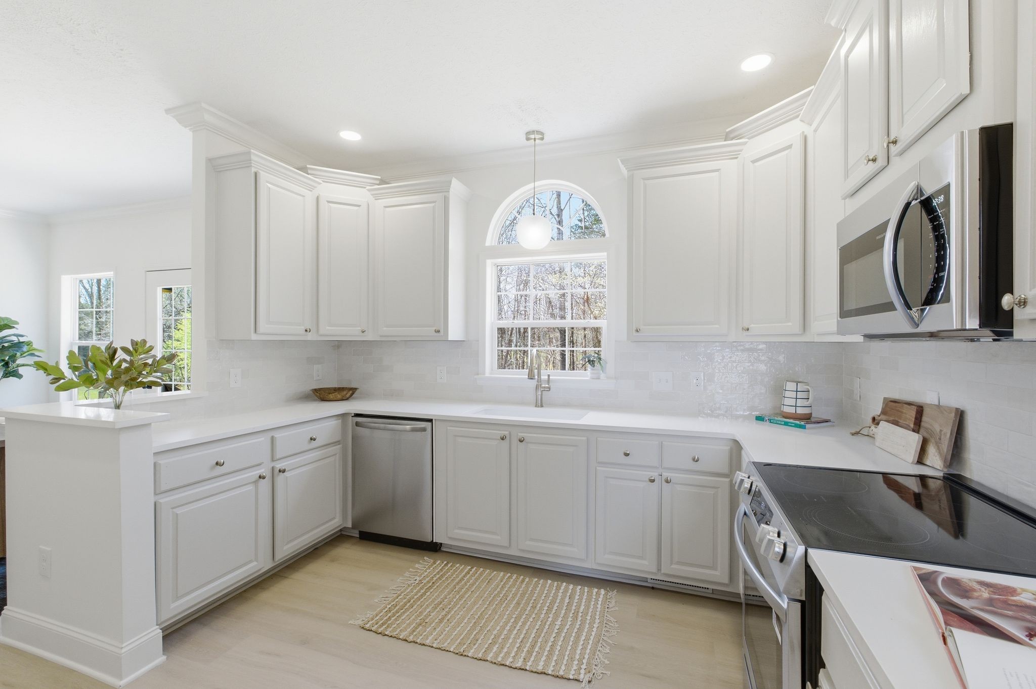 2113 Hanah Court Spring Hill, TN 37174 - Photo 12 of 36 a kitchen that has a sink and a stove in it