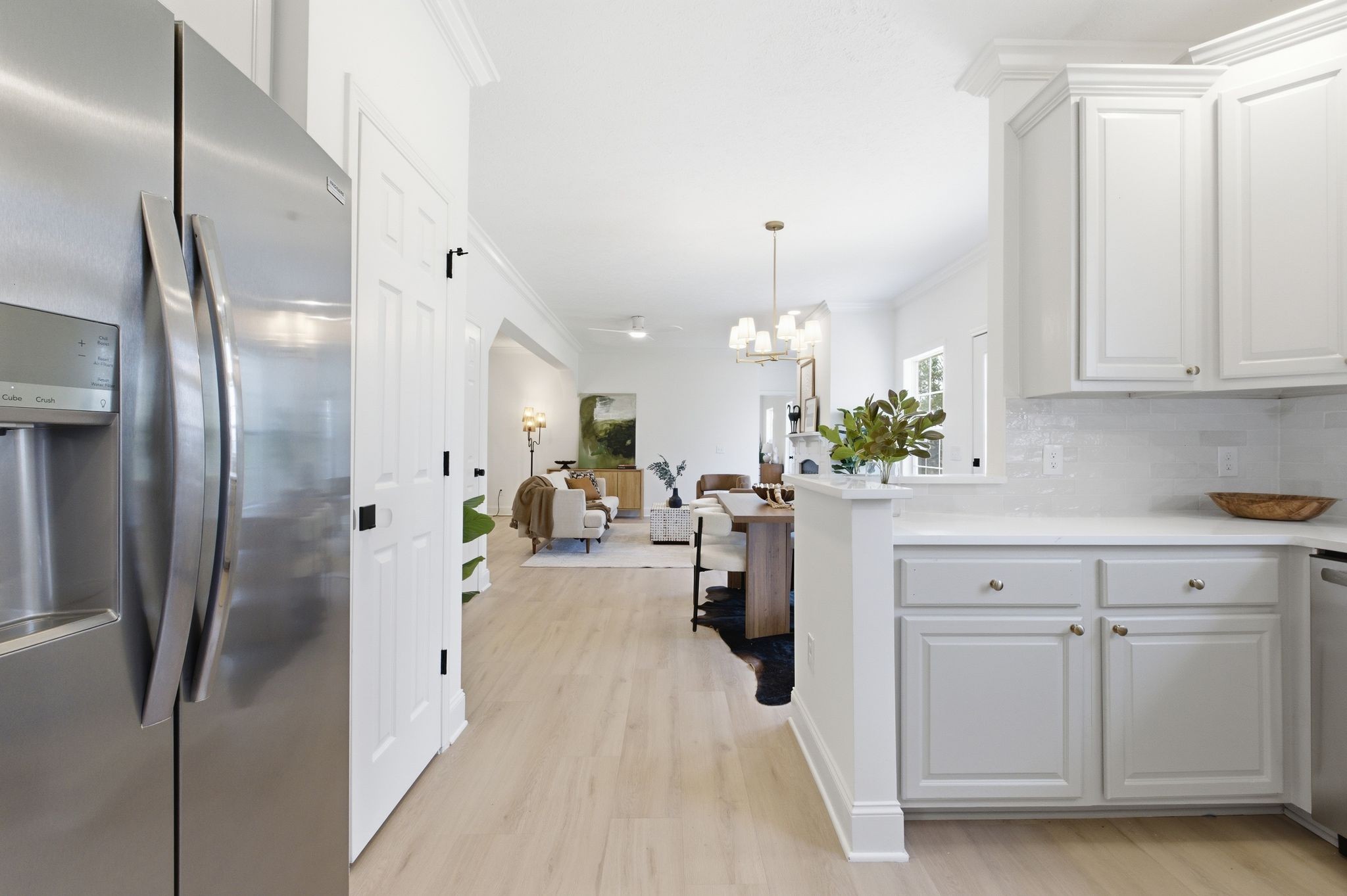 2113 Hanah Court Spring Hill, TN 37174 - Photo 13 of 36 a kitchen with white cabinets and refrigerator