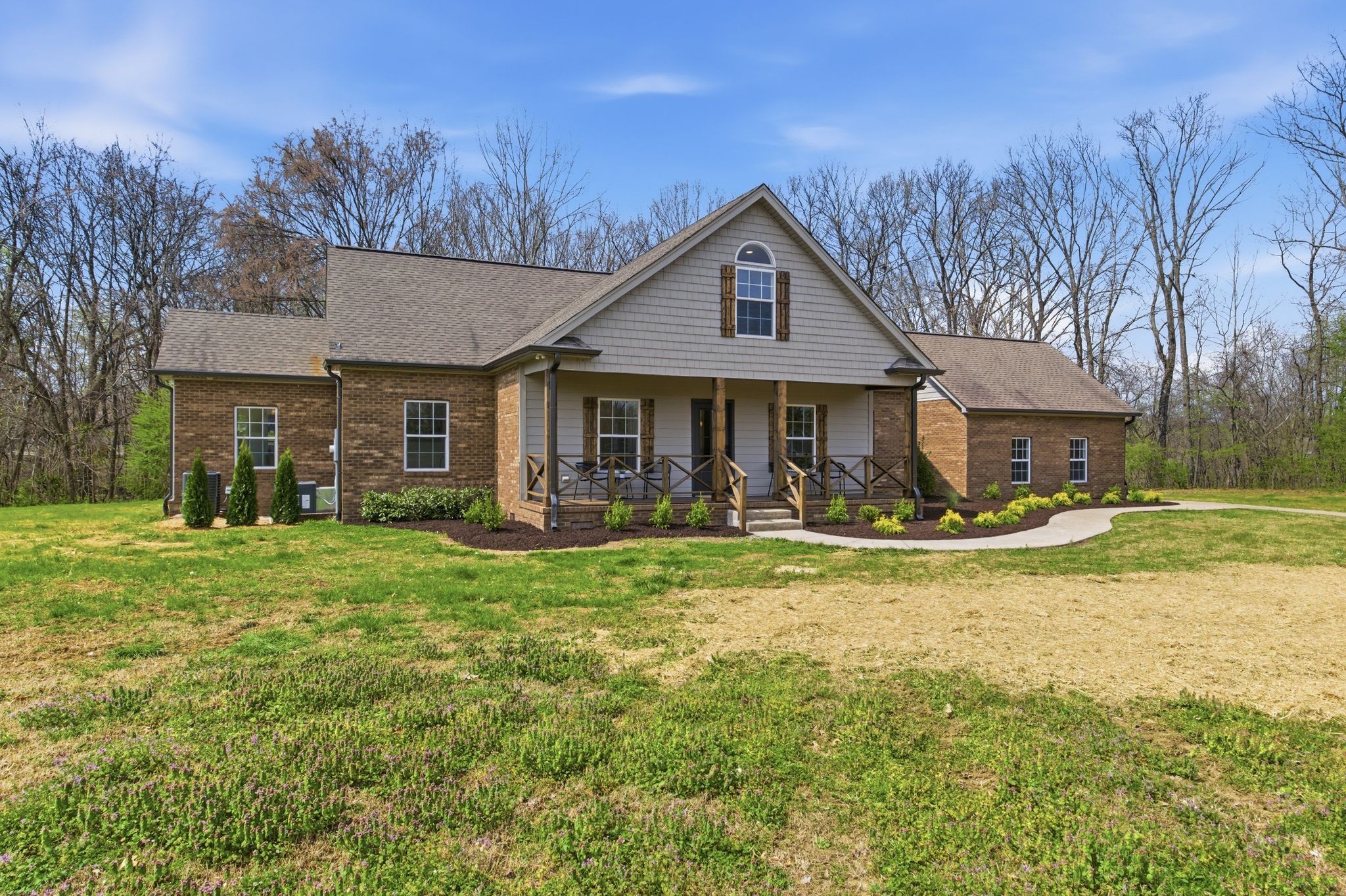 2113 Hanah Court Spring Hill, TN 37174 - Photo 2 of 36 a front view of a house with swimming pool having outdoor seating