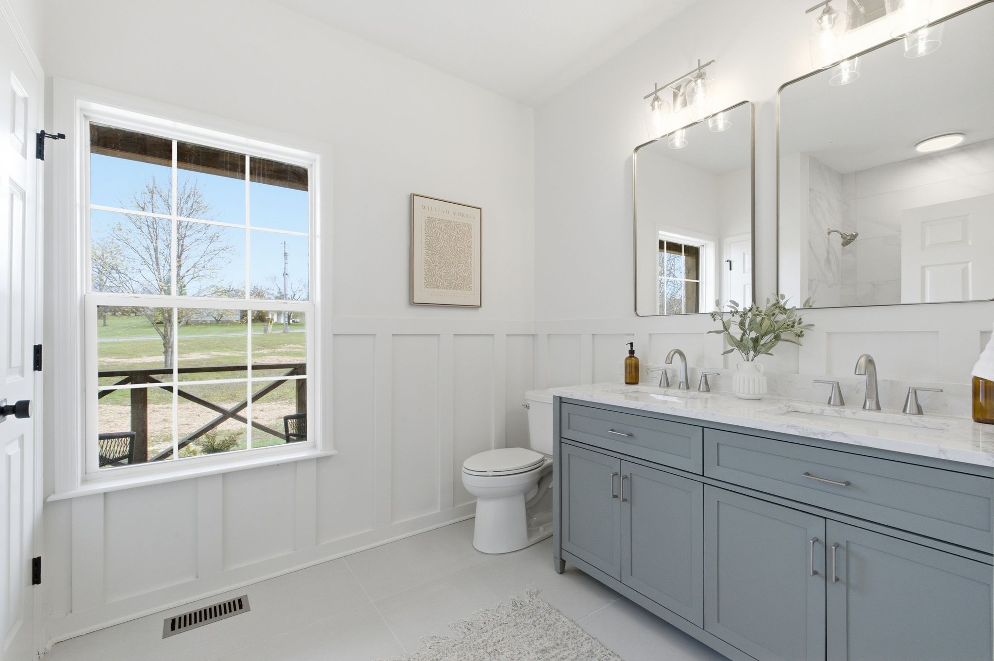 2113 Hanah Court Spring Hill, TN 37174 - Photo 21 of 36 a bathroom with a toilet a sink a large mirror and window
