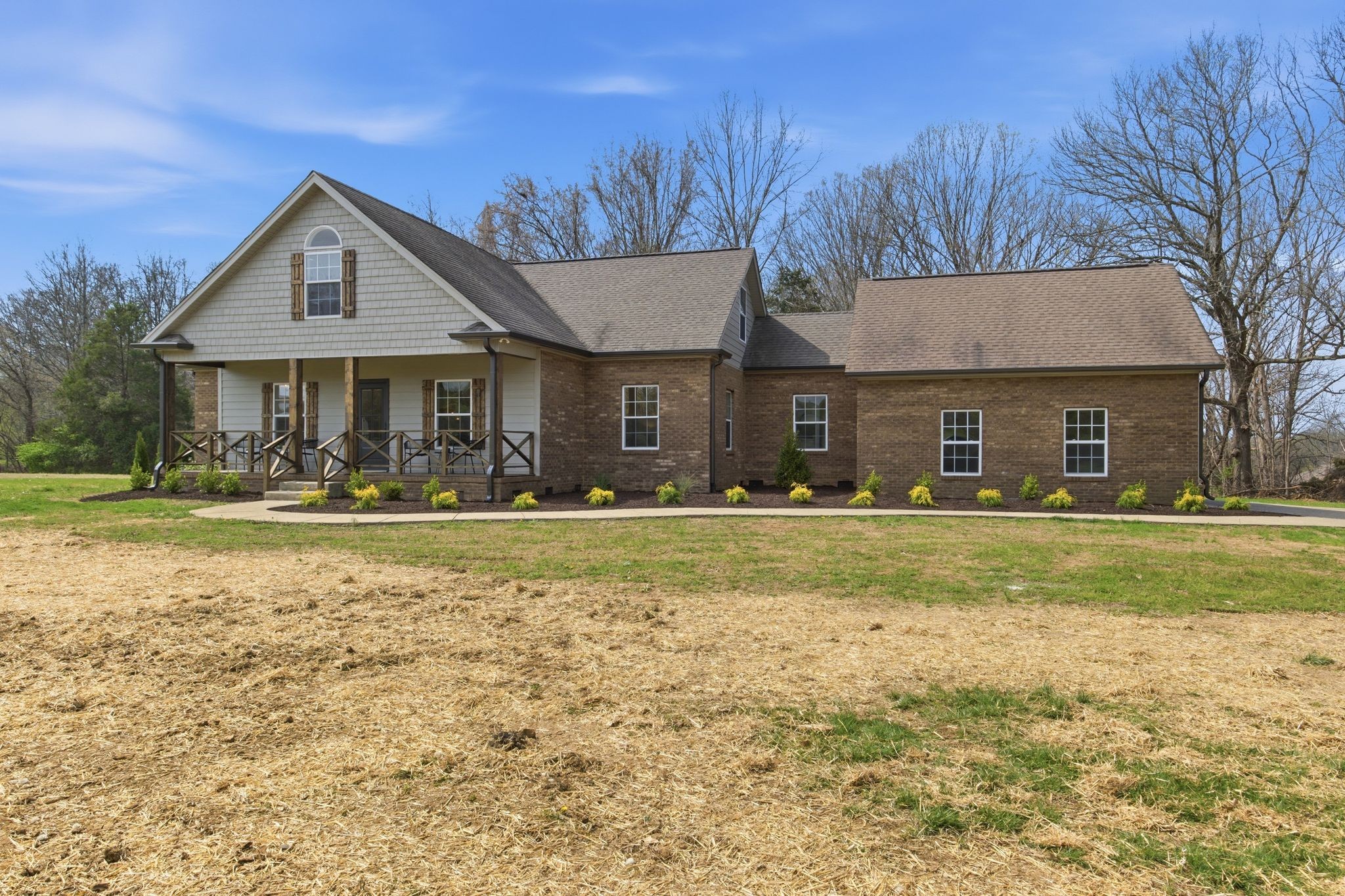 2113 Hanah Court Spring Hill, TN 37174 - Photo 3 of 36 a front view of a house with a yard table and chairs