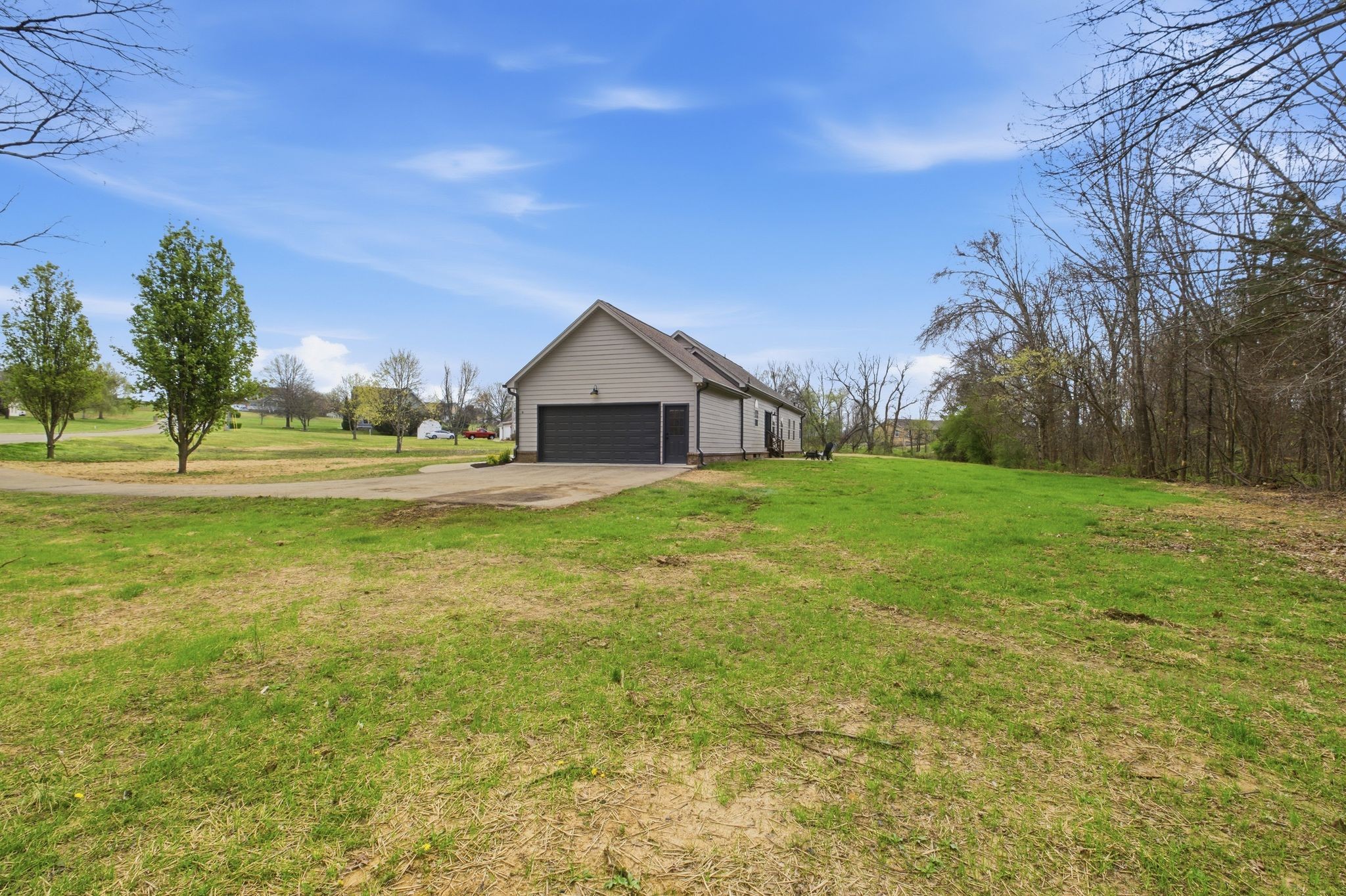 2113 Hanah Court Spring Hill, TN 37174 - Photo 35 of 36 a view of a house with a big yard