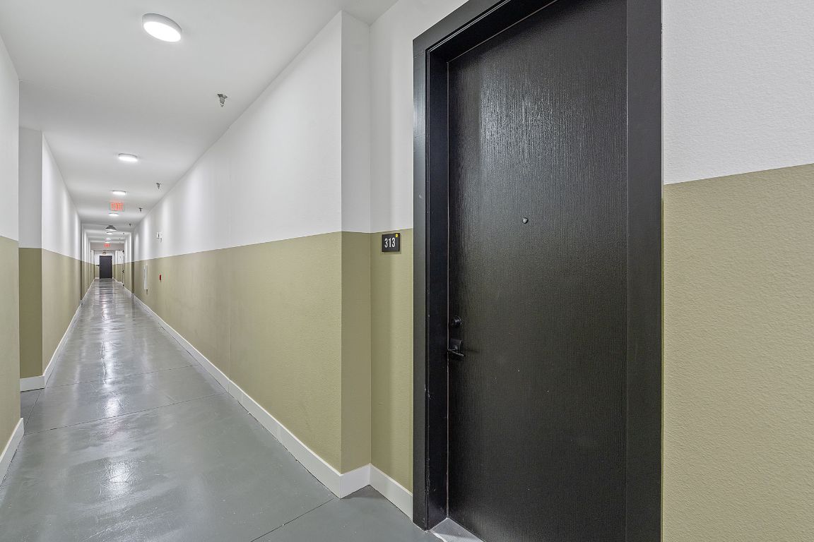 4315 South Congress Avenue, Unit 313 Austin, TX 78745 - Photo 20 of 38 a view of a hallway with stairs