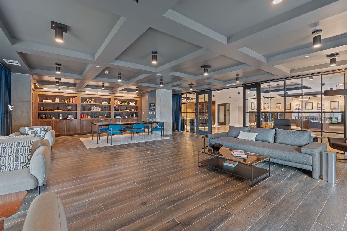 4315 South Congress Avenue, Unit 313 Austin, TX 78745 - Photo 21 of 38 a living room with furniture and a wooden floor