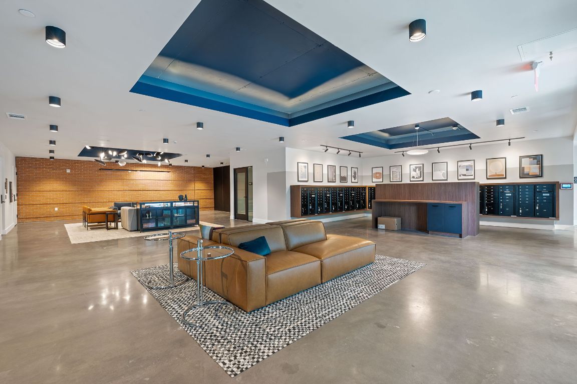 4315 South Congress Avenue, Unit 313 Austin, TX 78745 - Photo 23 of 38 a living room with furniture a fireplace and a flat screen tv