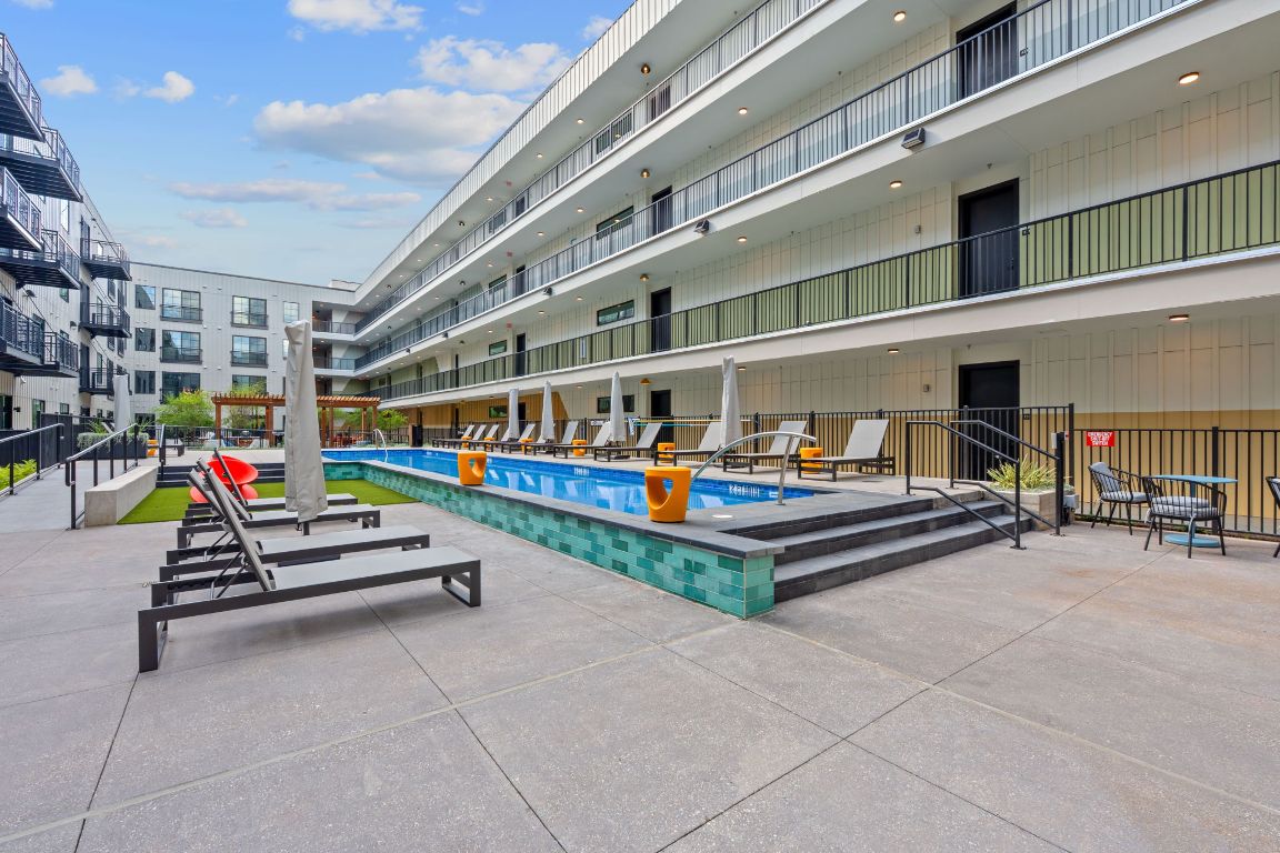 4315 South Congress Avenue, Unit 313 Austin, TX 78745 - Photo 33 of 38 a outdoor space with lots of swings and slides