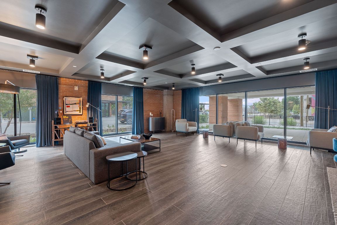 4315 South Congress Avenue, Unit 313 Austin, TX 78745 - Photo 38 of 38 a living room with furniture and wooden floor