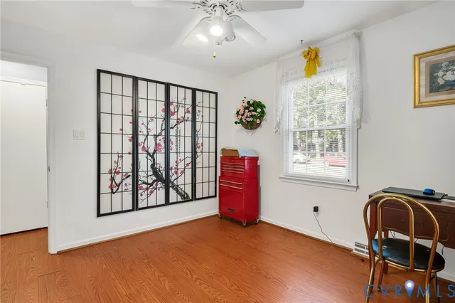 a view of workspace with furniture and window