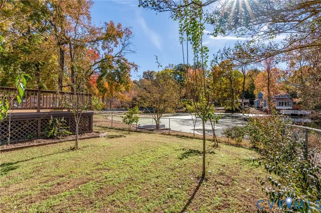 a view of a swimming pool with a bench
