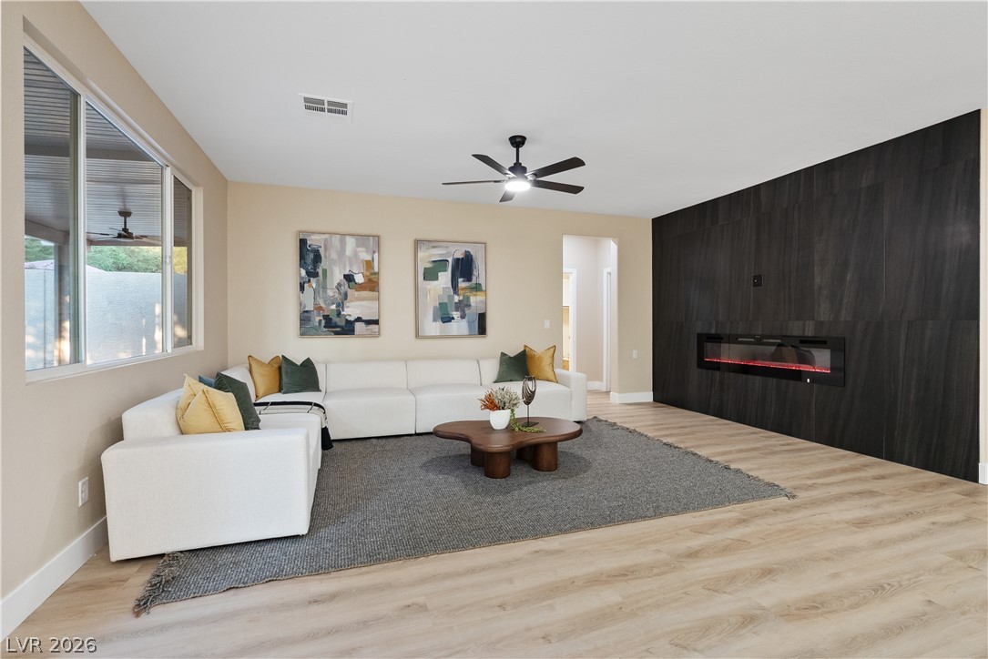 1662 Ravanusa Drive Henderson, NV 89052 - Photo 51 of 74 An inviting living area with a contemporary fireplace and abundant natural light.