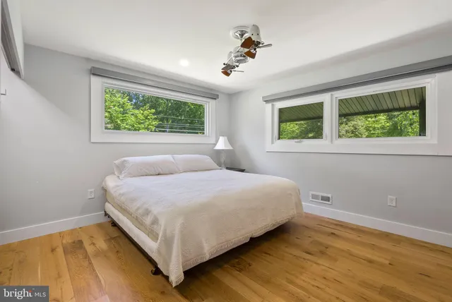a bedroom with a bed and window