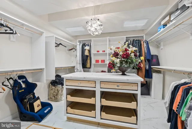 a kitchen with a sink and a chandelier