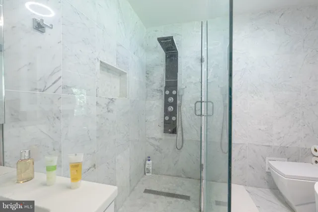 a bathroom with a shower and toilet