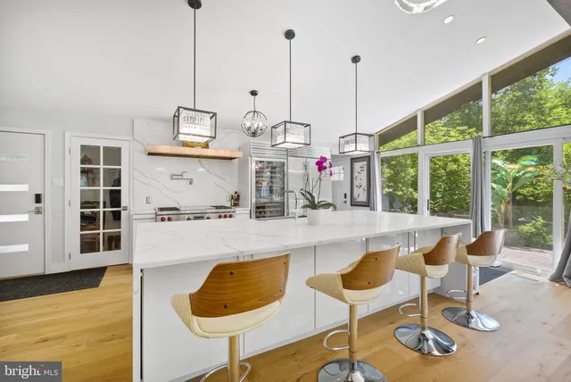 a dining table with chairs and wooden floor